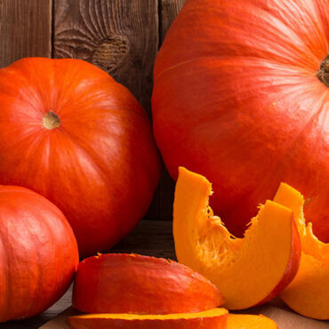 pumpkins on wooden board